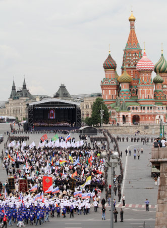 MOSCOW - MAY 24: Hundreds of orthodox believers walk near the Kremlin, while celebrating the Holiday of St. Cyril and Methodius, the creators of Cyrillic alphabet, May 24, 2010 in Moscow, Russia.のeditorial素材