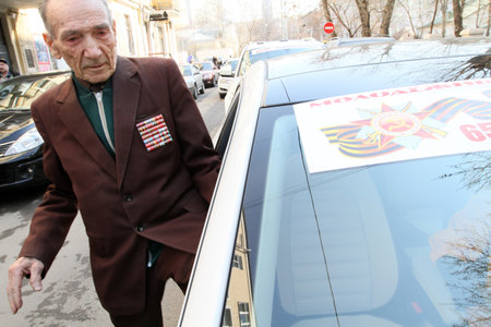 Action Give us a lift Veteran of the Moscow Government and the Youth Union of motorists, streetracers bused free veterans to various activities, April 14, 2010 in Moscow, Russia.のeditorial素材
