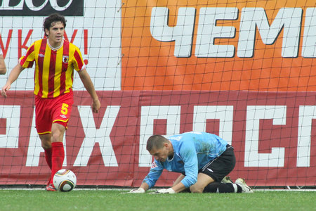 MOSCOW - MAY 15: Alania's midfielder George Floresku (L) and Alania's goalkeeper Mihail Kerzakov (R) in a game Dinamo Moscow vs. Alania Vladikavkaz - 2:0, May 15, 2010 in Moscow, Russia.のeditorial素材