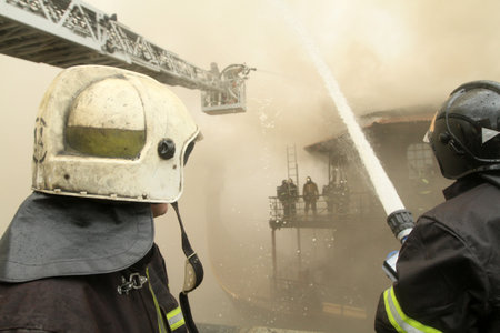 MOSCOW - APRIL 30: Firefighters extinguishing fire at the Viking floating restaurant on the...