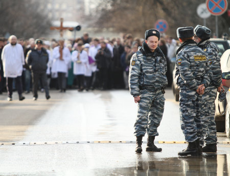 MOSCOW, RUSSIA - MARCH 25: Catholics walk in a procession held ahead of the Easter Holy Week, Saturday, March 25, 2010 in Moscow, Russia.のeditorial素材