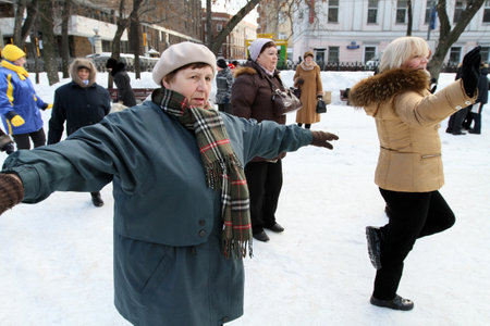 MOSCOW, RUSSIA - MARCH 6: Street action Winter fitness Boulevard, athletic groups active longevity involved in fitness at Tver Boulevard near the monument Yesenin, March 6, 2010 in Moscow, Russia.のeditorial素材