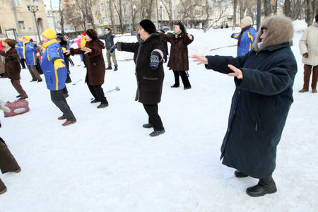 MOSCOW, RUSSIA - MARCH 6: Street action Winter fitness Boulevard, athletic groups active longevity involved in fitness at Tver Boulevard near the monument Yesenin, March 6, 2010 in Moscow, Russia.のeditorial素材