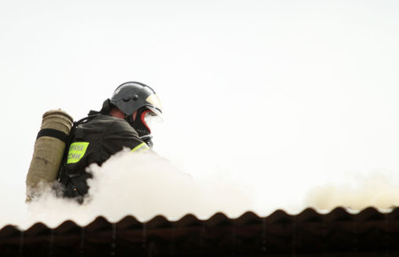 MOSCOW - APRIL 30: Firefighters extinguishing fire at the Viking floating restaurant on the Berezhkovskaya embankment, April 30, 2010 in Moscow, Russia.のeditorial素材