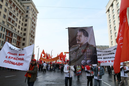 MOSCOW - MAY 1: Communist party supporters take part in a rally marking the May Day, a portrait of Soviet dictator Josef Stalin, May 1, 2010 in Moscow, Russia.のeditorial素材