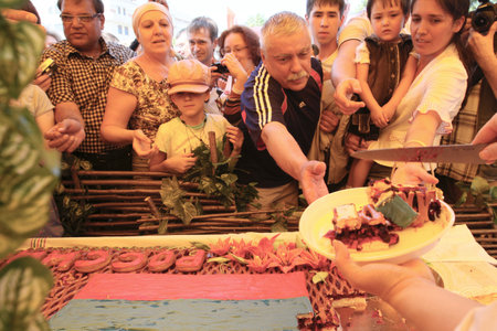 MOSCOW - JUNE 12: Celebrating the Day of Russia - cake measuring about half a meter brought from Moscow bakers at Revolution Square, June 12, 2010 in Moscow, Russia.のeditorial素材
