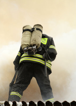 MOSCOW - APRIL 30: Firefighters extinguishing fire at the Viking floating restaurant on the Berezhkovskaya embankment, April 30, 2010 in Moscow, Russia.のeditorial素材