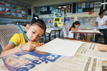 Pupil in a learning session during lesson drawing in primary school for poor, February 8, 2011 in Guayaquil, Ecuador.のeditorial素材