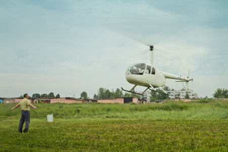 Yakhroma, Russia, June 25, 2011 - Carlson Cup-2011 Competitions on helicopter sports on the Robinson R44, in the First Helicopter Club Aerosoyuz in Moscow region.のeditorial素材