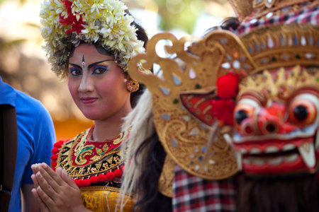 BALI, INDONESIA - APRIL 9: Balinese girl posing for turists before a classic national Balinese dance Barong on April 9, 2012 on Bali, Indonesia. Barong is very popular cultural show on Bali.のeditorial素材