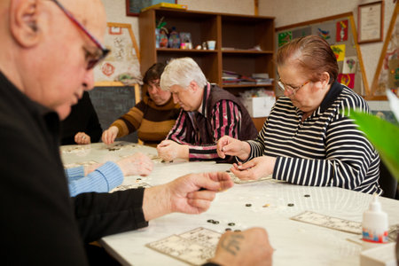 PODPOROZHYE, RUSSIA - MAY 3: Day of Health in Center of social services for pensioners and disabled (Lotto - exercises for development of attention for eldery), May 3, 2012 in Podporozhye, Russia.のeditorial素材
