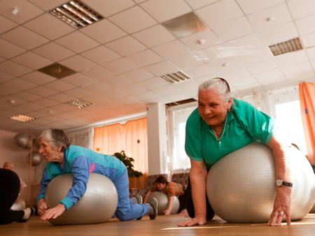 PODPOROZHYE, RUSSIA - MAY 4: Day of Health in Center of social services for pensioners and disabled Otrada (gymnastics with ball for eldery), May 4, 2012 in Podporozhye, Russia.のeditorial素材