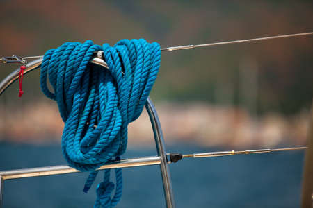 Close-up of a mooring rope on a modern yacht, background image with space for text or logos.の写真素材