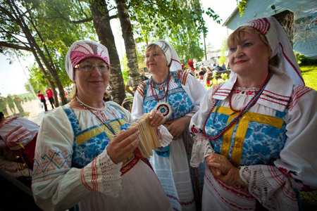 VINNICI, LENINGRAD REGION, RUSSIA - JUNE 10: Local people during celebrate the annual holiday Vepsian national culture Tree of Life (vepssk.Elo-pu), June 10, 2012 in the village Vinnici, Russia.のeditorial素材