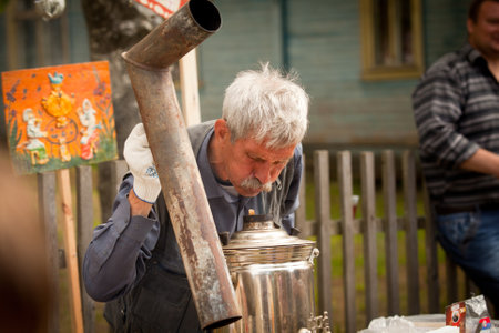 VINNICI, LENINGRAD REGION, RUSSIA - JUNE 10: Local people during celebrate the annual holiday Vepsian national culture Tree of Life (vepssk.Elo-pu), June 10, 2012 in the village Vinnici, Russia.のeditorial素材