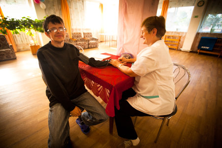 PODPOROZHYE, RUSSIA - JULY 3: Day of Health in Center of social services for pensioners and the disabled Otrada (Medical examination of disabled), July 3, 2012 in Podporozhye, Russia.のeditorial素材