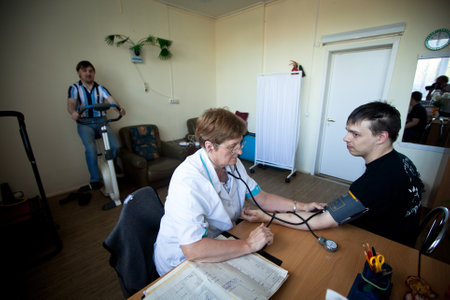 PODPOROZHYE, RUSSIA - JULY 3: Day of Health in Center of social services for pensioners and the disabled Otrada (Medical examination of disabled), July 3, 2012 in Podporozhye, Russia.のeditorial素材