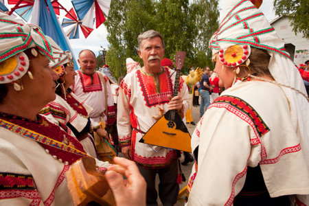 VINNICI, LENINGRAD REGION, RUSSIA - JUNE 10: Local people during celebrate the annual holiday Vepsian national culture Tree of Life (vepssk.Elo-pu), June 10, 2012 in the village Vinnici, Russia.のeditorial素材