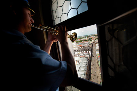 KRAKOW, POLAND - JULY 19: Heynal (St. Mary dawn) also known as the Cracovian Hymn played by a trumpeter from the highest tower of St. Mary Church, July 19, 2012 in Krakow, Poland. のeditorial素材