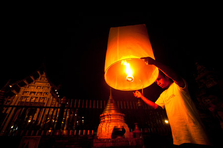 CHIANGMAI,THAILAND - DEC 31: People release sky lanterns during the New Year celebrations, Dec 31, 2012 in Chiangmai, Thailand. Launching sky lanterns symbolize worship Buddhaのeditorial素材