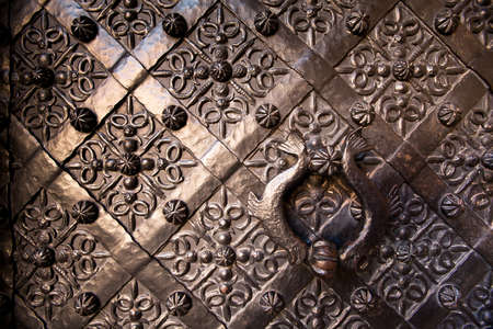 Old door with ornament in stone wall in Royal Wawel Castle, Poland の写真素材
