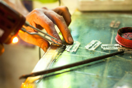 CHANG, THAILAND - DEC 24: Unidentified master prepare tools for traditional tattoo bamboo, Dec 24, 2012 in Koh Chang. Thai tattooists are very popular among tourists prices range from 500 baht and upのeditorial素材