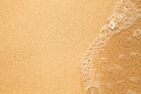Beach sand texture, soft wave of the sea 