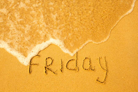 Friday - written in sand on beach texture - soft wave of the sea  days week series の写真素材