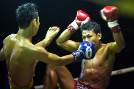 CHANG, THAILAND - FEB 22: Unidentified Muay Thai fighters compete in an amateur kickboxing match, Feb 22, 2013 on Chang, Thailand. Muay Thai practiced over 120000 fans and nearly 10000 professionals.のeditorial素材