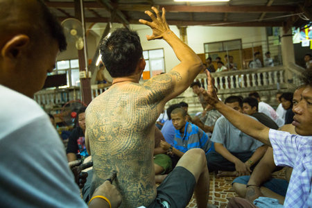 NAKHON CHAI, THAILAND - MAR 23: Unidentified participant Master Day Ceremony able Khong Khuen - spirit possession during the Wai Kroo at Wat Bang Pra on Mar 23, 2013 in Nakhon Chai, Thailand.のeditorial素材