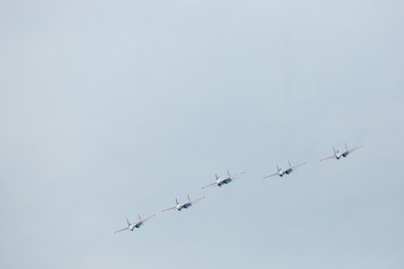 LANGKAWI, MALAYSIA - MAR 26: Russian Air Force Aerobatic Team Russian Knights performing during on LIMA13 Langkawi International Maritime & Aerospace Exhibition on Mar 26, 2013 in Langkawi, Malaysia.のeditorial素材