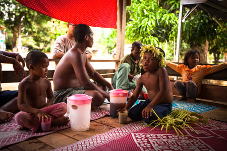 BERDUT, MALAYSIA - APR 8: Unidentified children Orang Asli in his village on Apr 8, 2013 in Berdut, Malaysia. More than 76% of all Orang Asli live below the poverty line, life expectancy - 53 years old.のeditorial素材