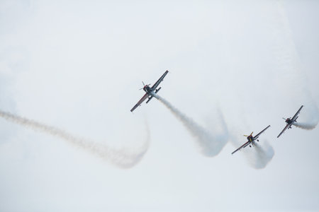 LANGKAWI, MALAYSIA - MAR 26: Malaysia Aerobatic Team X330L Krisakti performing during on LIMA'13 - Langkawi International Maritime & Aerospace Exhibition on Mar 26, 2013 in Langkawi, Malaysia.のeditorial素材