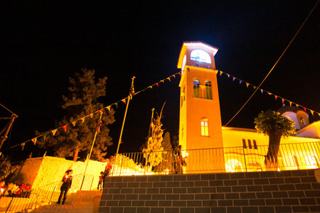 METHANA, GREECE - MAY 5: Unidentified people in the street during the celebration of Orthodox Easter, May 5, 2013 in Methana, Greece.のeditorial素材