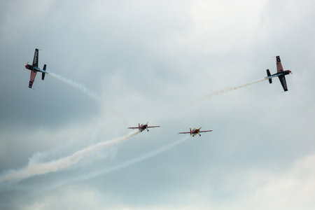 LANGKAWI, MALAYSIA - MAR 26: Malaysia Aerobatic Team X330L Krisakti performing during on LIMA'13 - Langkawi International Maritime & Aerospace Exhibition on Mar 26, 2013 in Langkawi, Malaysia.のeditorial素材