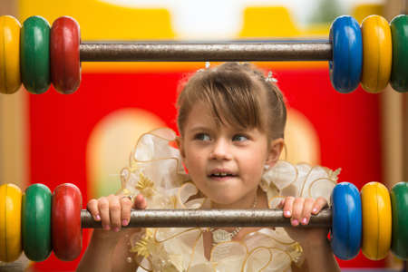 Portrait of a baby girl on the playground の写真素材
