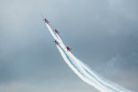 LANGKAWI, MALAYSIA - MAR 26: Malaysia Aerobatic Team X330L Krisakti performing during on LIMA'13 - Langkawi International Maritime & Aerospace Exhibition on Mar 26, 2013 in Langkawi, Malaysia.のeditorial素材