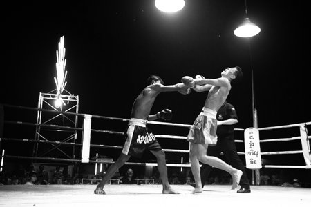 CHANG, THAILAND - FEB 22: Unidentified Muaythai fighter in ring during match (black and white high-contrast series), Feb 22, 2013 on Chang, Thailand. For many Thai men, Muaythai only way to break out of poverty, per battle pay to 7000 baht.のeditorial素材
