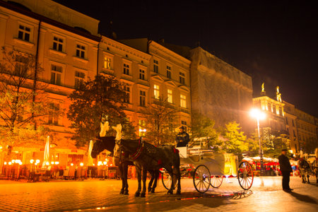 KRAKOW, POLAND - OCT 19: One of the streets in historical center of Krakow, Oct 19, 2013 in Krakow, Poland. This year the city was visited by 8.1 million tourists, which is the highest level.のeditorial素材