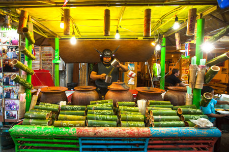 PAI, THAILAND - JAN 2: Street vendor in Pai on Jan 2, 2013 in Pai, Thailand. During high season, tourist numbers swell to the point where Pai experiences as shortages of electricity, water and petrol.のeditorial素材