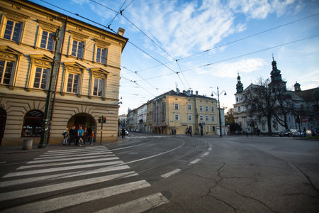 KRAKOW, POLAND - OCT 20: One of the streets in historical center of Krakow, Oct 20, 2013 in Krakow, Poland. This year the city was visited by 8.1 million tourists, which is the highest level.のeditorial素材