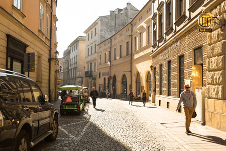 KRAKOW, POLAND - OCT 22: One of the streets in historical center of Krakow, Oct 22, 2013 in Krakow, Poland. This year the city was visited by 8.1 million tourists, which is the highest level.のeditorial素材