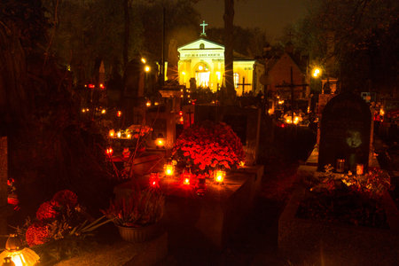 KRAKOW, POLAND - NOV 1: The evening before All Saints Day on Rakowicki Cemetery , Nov 1, 2013 in Krakow, Poland. Founded at the beginning of the 19th century (42 hectares) is one of the best known cemeteries of Poland.のeditorial素材
