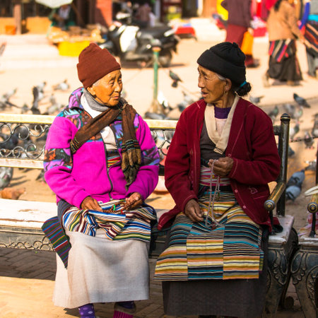 KATHMANDU, NEPAL - DEC 8: Unidentified pilgrims circle stupa Boudhanath, Dec 8, 2013 in Kathmandu, Nepal. Stupa is one of the largest in the world, of 1979 is a UNESCO World Heritage Site.のeditorial素材
