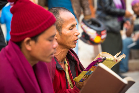 KATHMANDU, NEPAL - DEC 2: Unidentified pilgrims circle stupa Boudhanath, Dec 2, 2013 in Kathmandu, Nepal. Ancient Stupa is one of the largest in the world, of 1979 is a UNESCO World Heritage Site.のeditorial素材