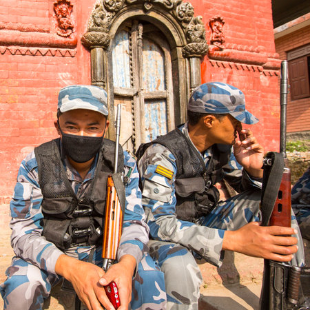 KATHMANDU, NEPAL - Oct 19: Unknown nepalese soldiers Armed Police Force near the public school, Dec 19, 2013 in Kathmandu, Nepal. Armed Police Force tasked with counterinsurgency operations in Nepal.のeditorial素材