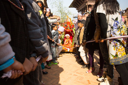 BHAKTAPUR, NEPAL - DEC 20: During Birthday celebration head of family - 77 years 7 months 7 days 7 hours old, like rebirth according to Newar, Dec 20, 2013 in Bhaktapur, Nepal.のeditorial素材
