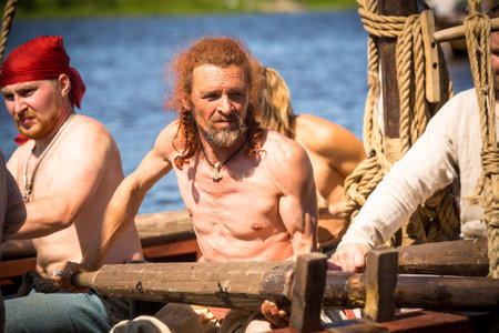 LADOGA, RUSSIA - JULY 13: During of international historical festival Ladogafest-2013 on July 13, 2013 on Ladoga, Russia. On 12-14 of July Ladoga festival will bring to life a viking age old harbour.のeditorial素材