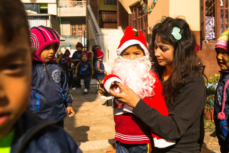 KATHMANDU, NEPAL - DEC 22: Unknown pupils during lesson in primary school, Dec 22, 2013 in Kathmandu, Nepal. Only only 25% of girls attend schools and half of the children can reach the 5 grade.のeditorial素材