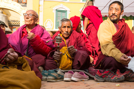 KHATMANDU, NEPAL - DEC 17: Unidentified Buddhist pilgrims near stupa Boudhanath during festive solemn Puja of H.H. Drubwang Padma Norbu Rinpoche's reincarnation's, Dec 17, 2013 in Khatmandu, Nepal.のeditorial素材